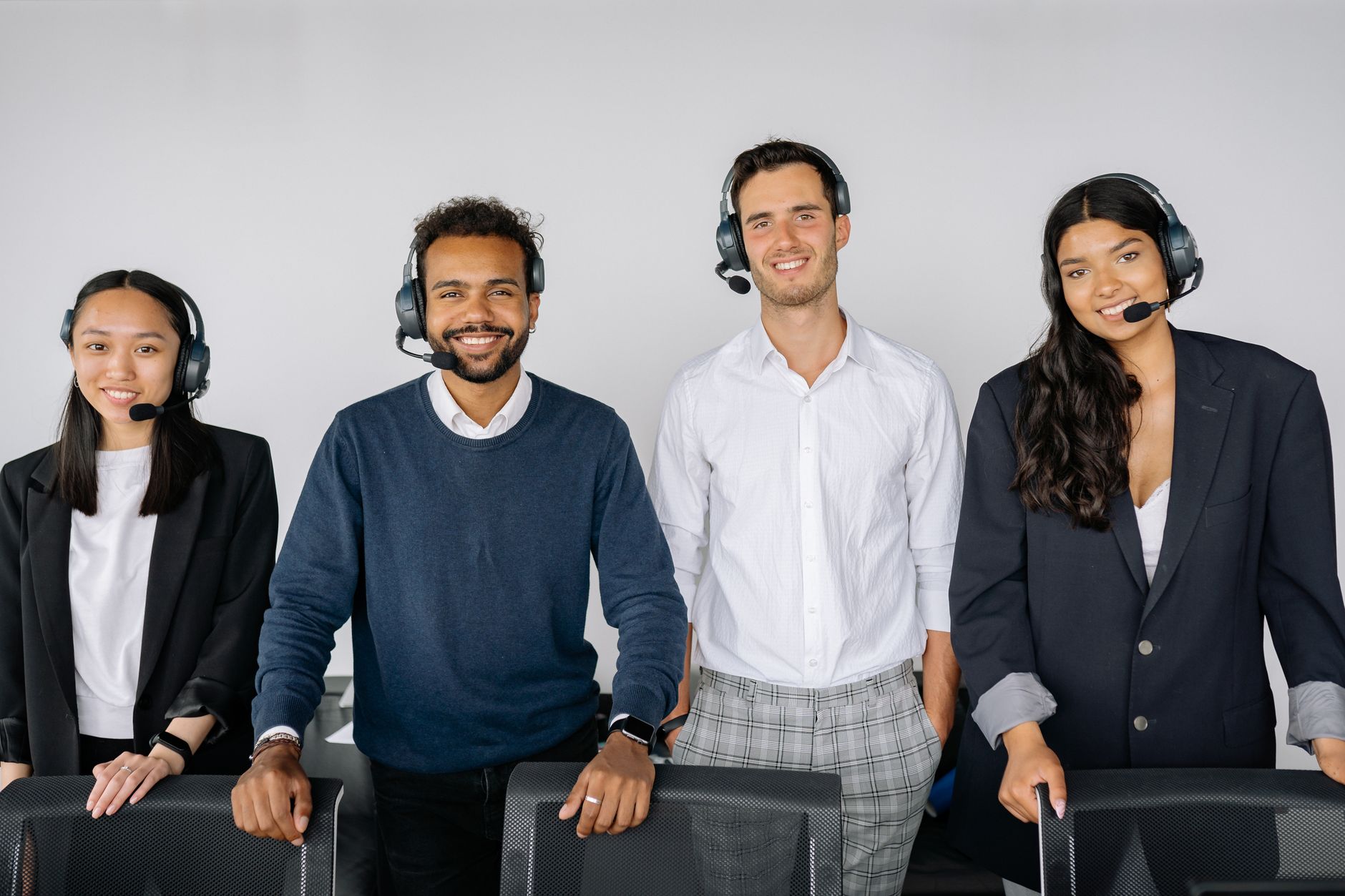 Support team with headsets answering customer queries