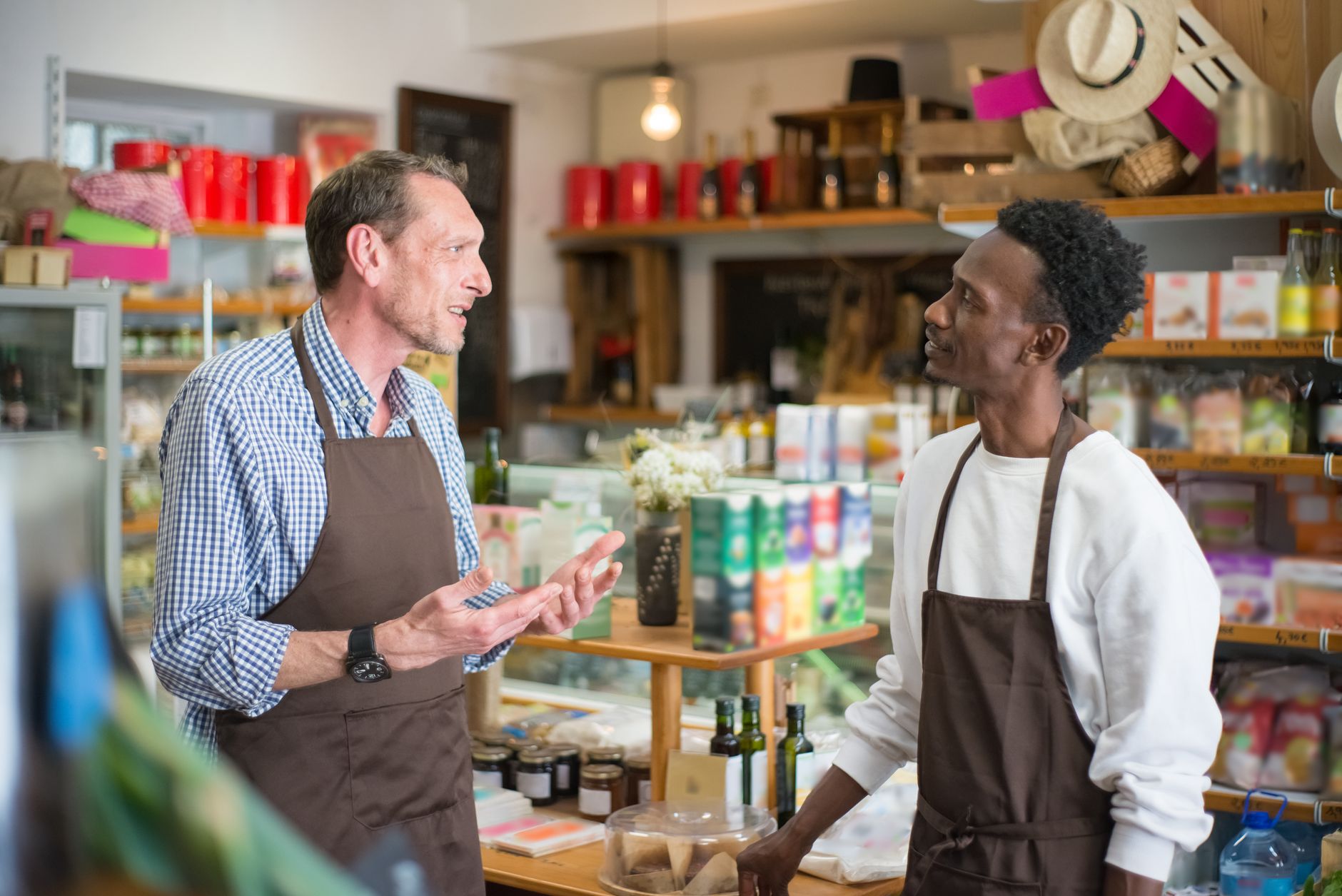 Franchise store employee serving a customer at the counter