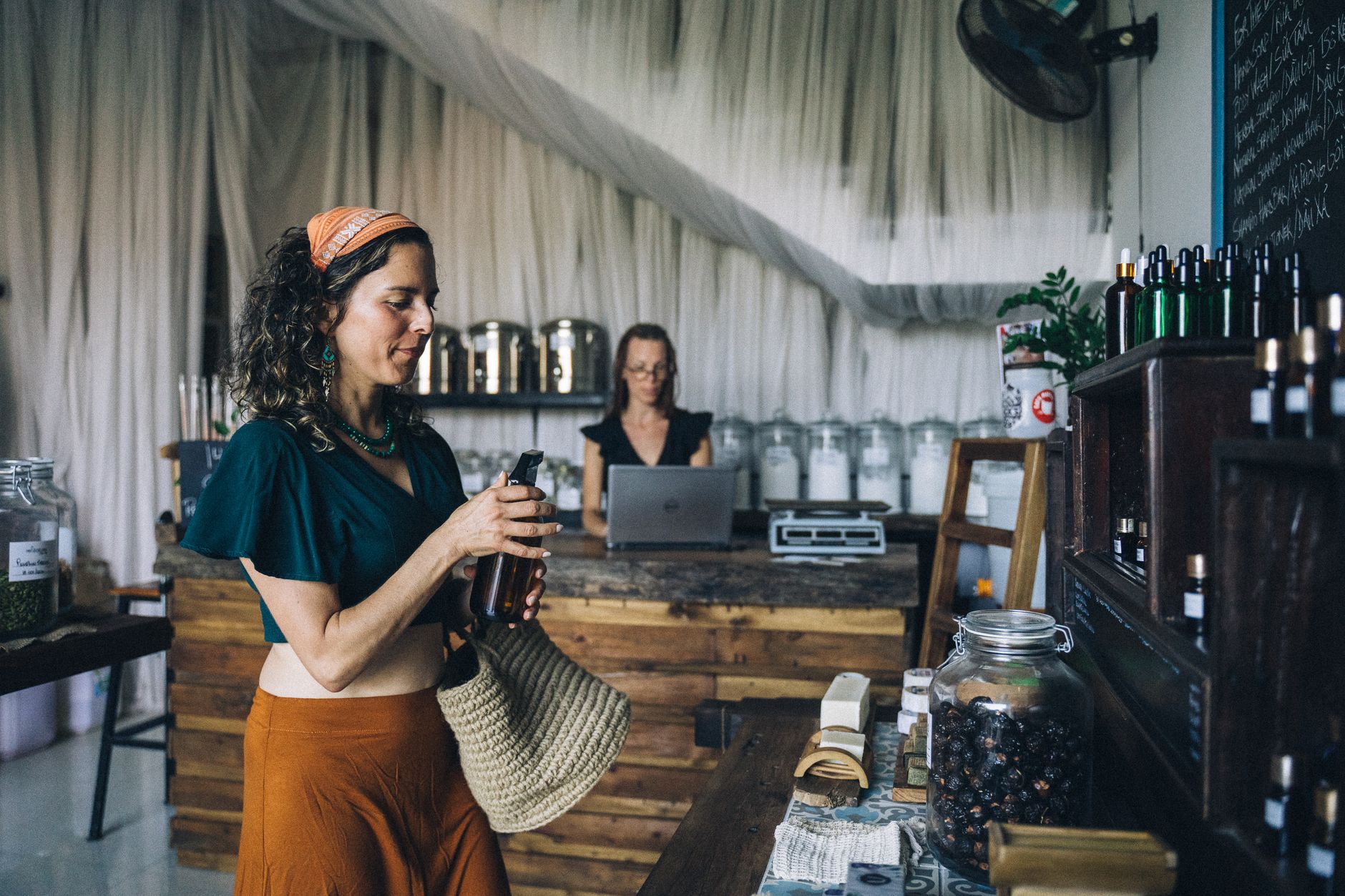 Customer receiving an eco-friendly product from a shop assistant