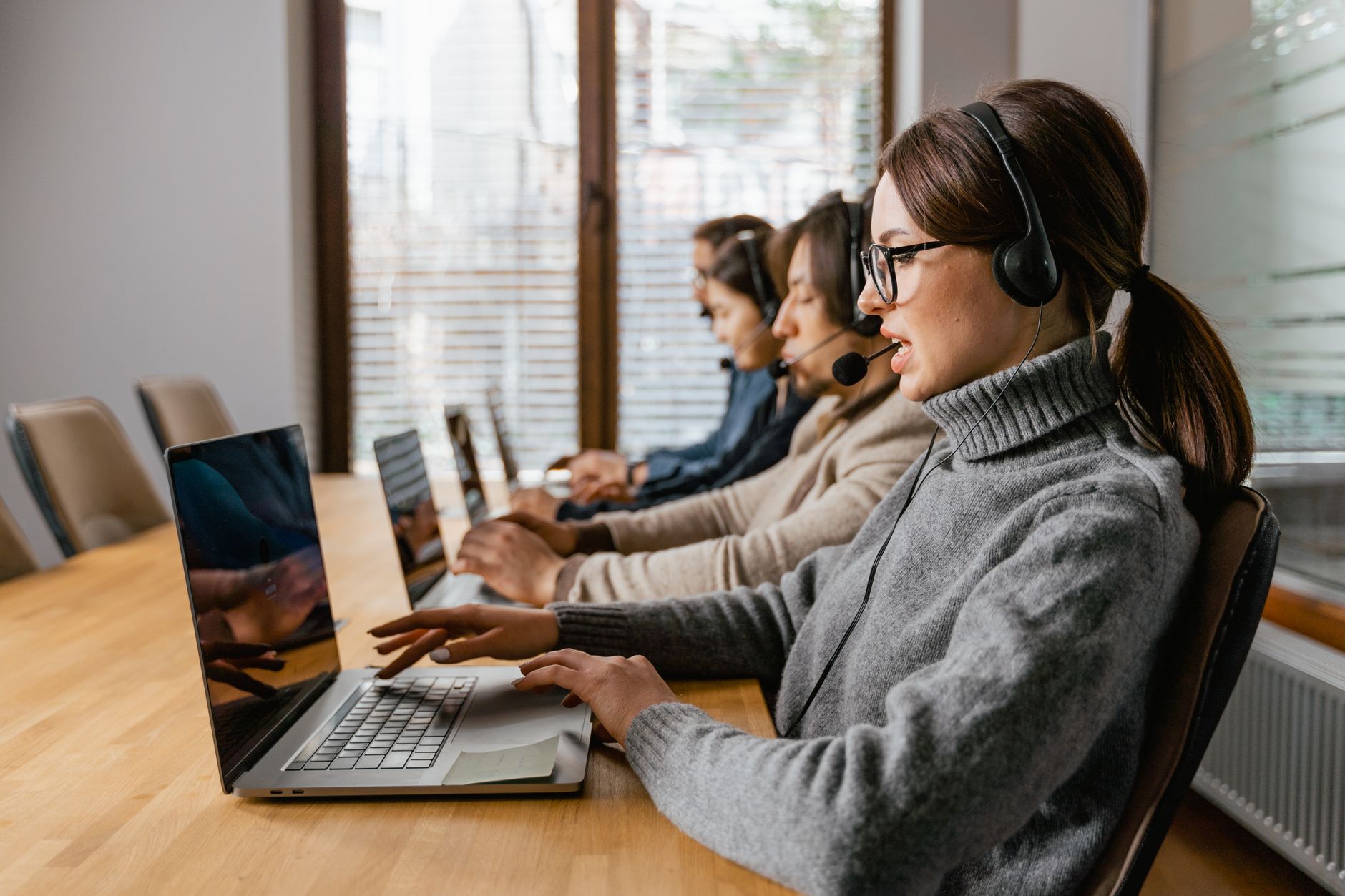 Sales team working with CRM software on laptop dashboard