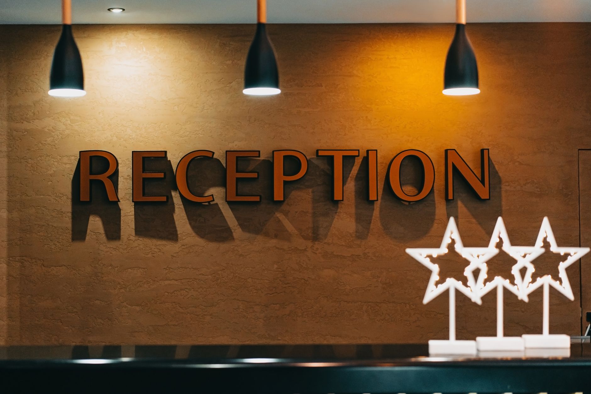 Hotel reception desk with professional staff during mystery audit
