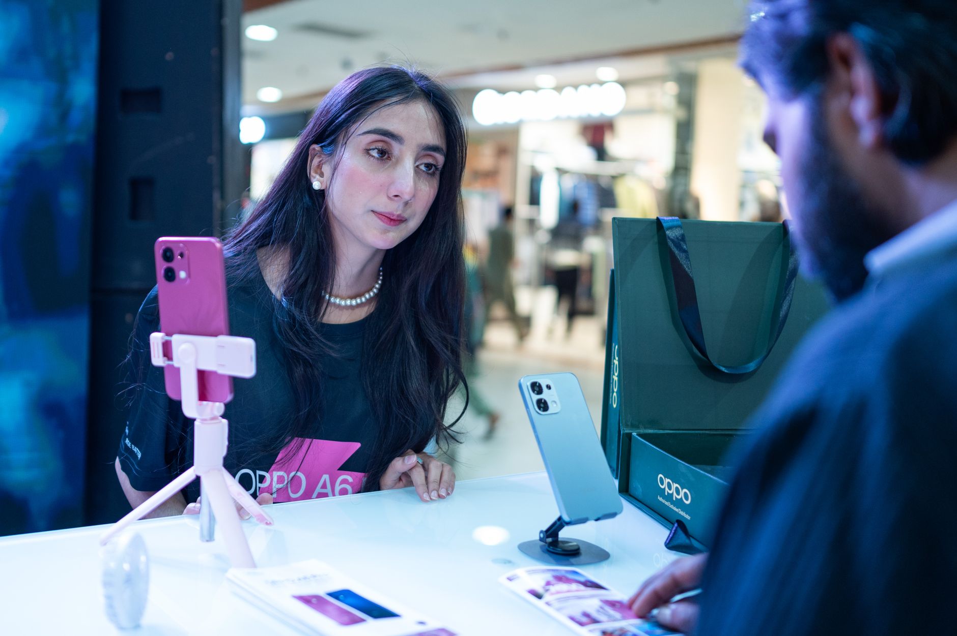 Telecom store advisor assisting a customer