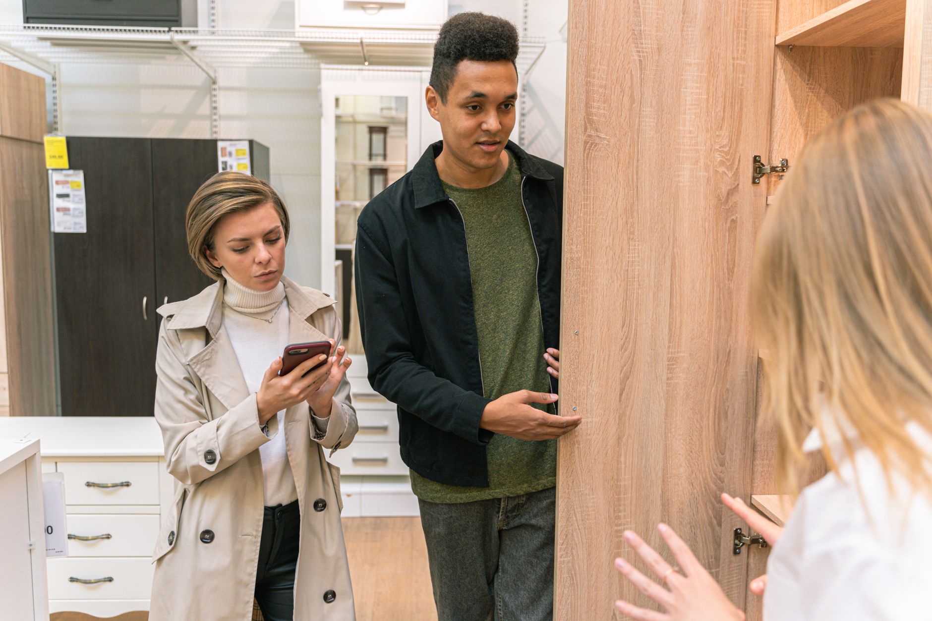 Customer at a mobile phone store checking rate plans